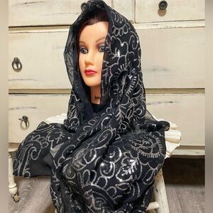Elegant black sheer scarf featuring delicate silver sequin